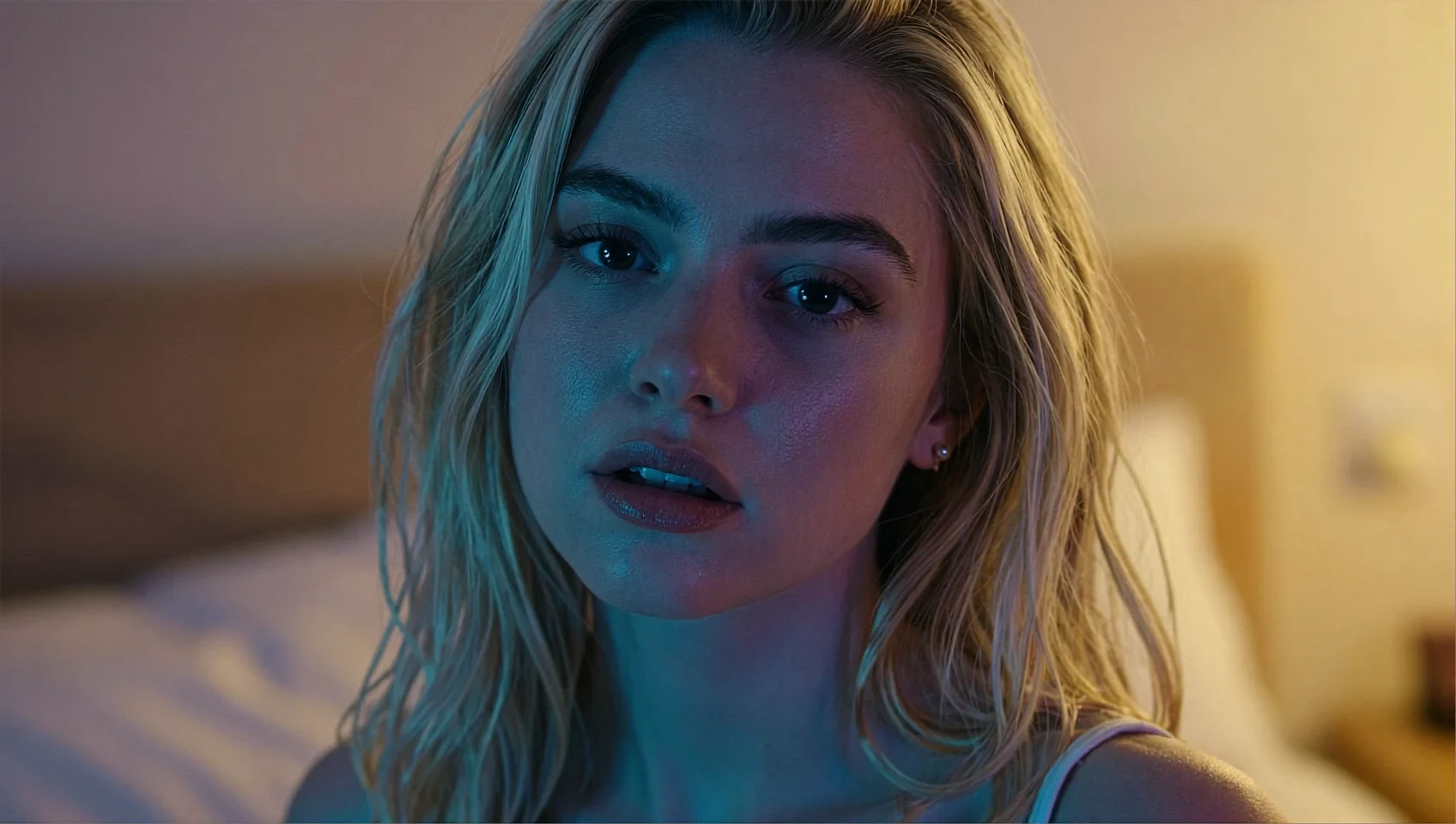 Share card: blonde fictional AI character in a bedroom under cool blue light