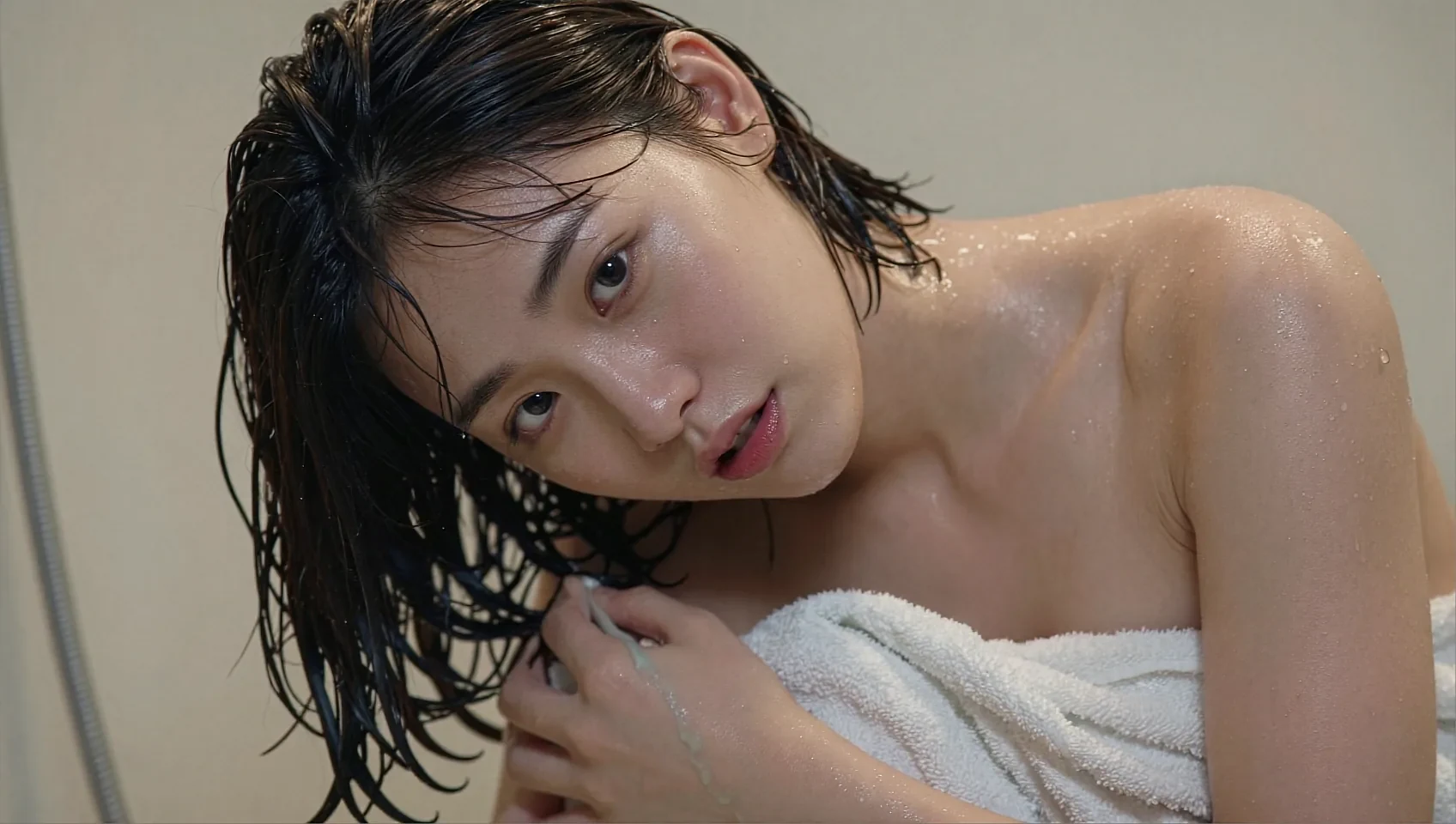 Share card: fictional AI character with wet hair wrapped in a white towel
